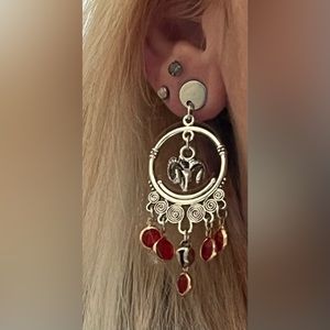 SGC619 handmade Aries ram, circular, jingle, dangle, red gem accents earrings
